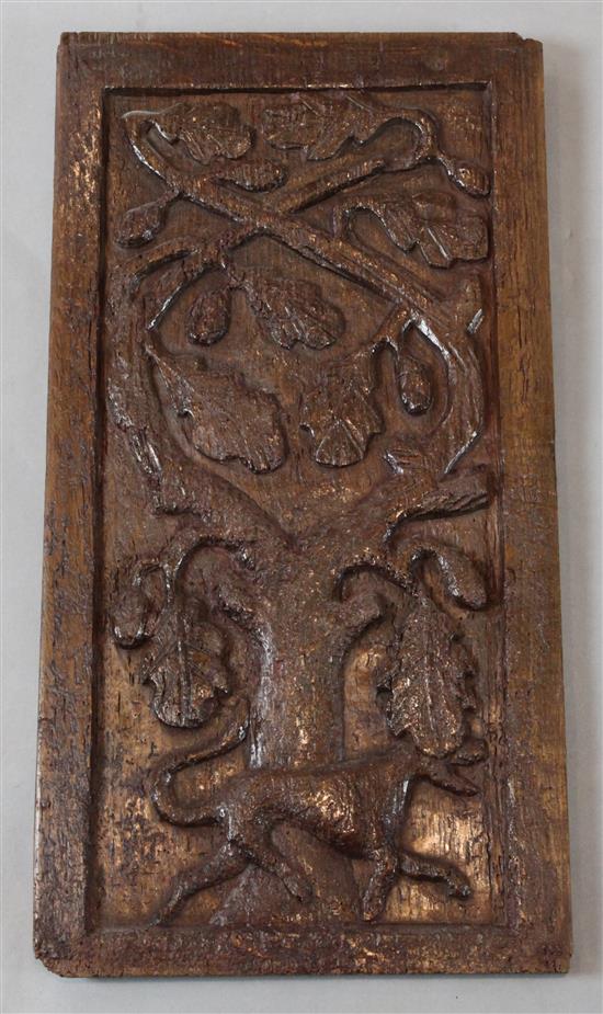 A 17th century oak panel, 21 x 11in.